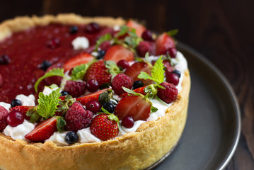 Food styling with fresh fruit tart berries.