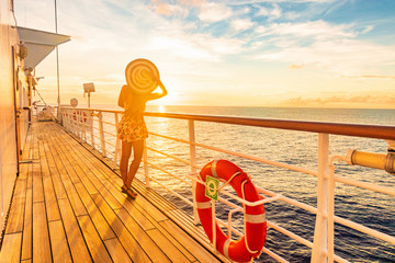 Cruise vacation woman watching sunset on deck - Caribbean tropical holiday travel lifestyle.