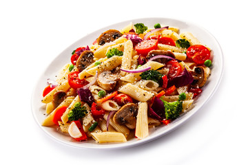 Penne with meat and vegetables on white background
