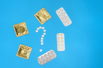 contraceptive pills and condom. Protection, and safe sex. Contraception, birth control. medical concept top view, Flat lay