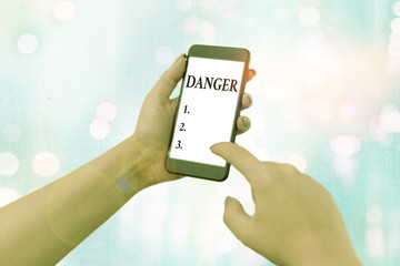 Conceptual hand writing showing Danger. Concept meaning the possibility of something unwelcome or...