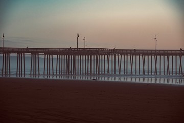 Naklejka premium sunset over the wooden pier of Pismo Beach California