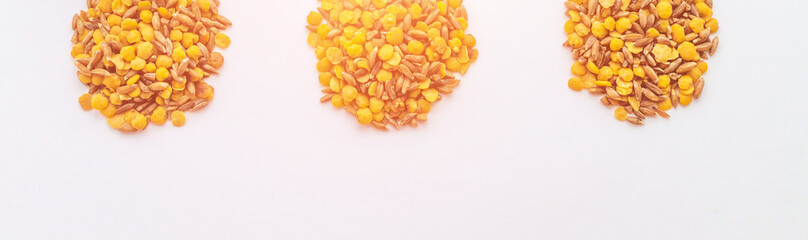 several piles of lentils and spelt on a white background. Healthy lifestyle, vegetarianism. Fight with excess weight.
