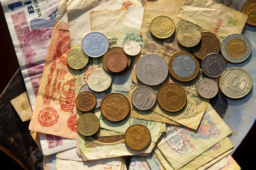 Coins, paper bills, money from different countries close-up. Old money.
