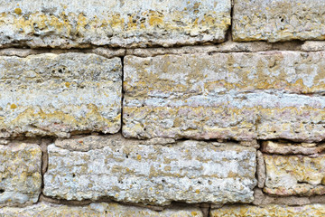old ancient vintage wall close - up of stone, background texture