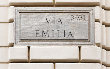 Via Emilia sign on wall in Rome