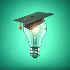 Eduction and gradfuation concept. Light bulb with graduation hat on green  background.