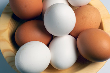 eggs on a wooden plate close-up