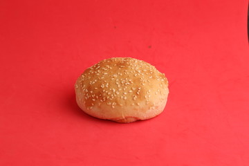 delicious bread rolls on colored background
