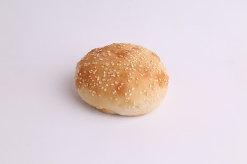 delicious bread rolls on colored background