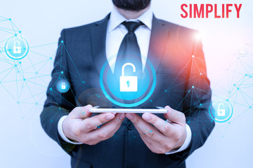 Writing note showing Simplify. Business concept for make something simpler or easier to do or...