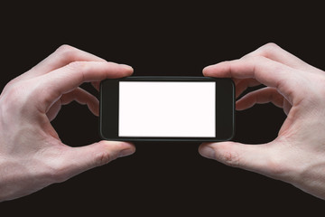 Two Hands Holding Mobile Phone with Empty White Screen Isolated on Black Background - Photographer or Videographer with Smartphone Frame