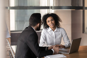 African businesswoman consulting arab client at office meeting