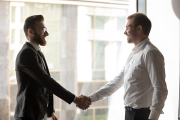 Business partner diverse businessmen greet each other shaking hands