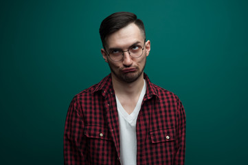 Obraz premium Portrait of a funny young interested man