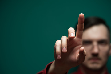 Man's hand clicks on an invisible touchpad