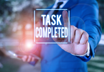 Handwriting text writing Task Completed. Conceptual photo Finished action or assignments that has no remaining duration Businessman with pointing finger in front of him