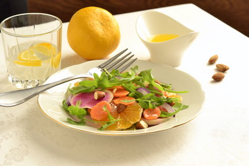 Citrus salad with radishes, carrots and arugula.