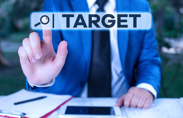 Handwriting text Target. Conceptual photo demonstrating object or place selected as the aim of attack Life goal Businessman with pointing finger in front of him