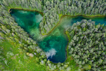 Antu blue springs lake, Estonia, Europe. Artesian well, clean drinking groundwater erupting out of...