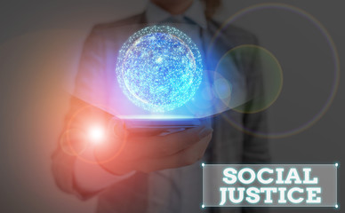 Writing note showing Social Justice. Business concept for Equal access to wealth and privileges within a society Elements of this image furnished by NASA