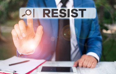 Handwriting text Resist. Conceptual photo To fight against something or someone that is attacking you Businessman with pointing finger in front of him