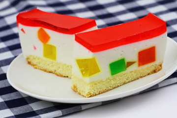 Cheesecake with colorful, fruity jelly pieces, closeup