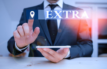 Handwriting text Extra. Conceptual photo Added to existing or usual amount number In addition...
