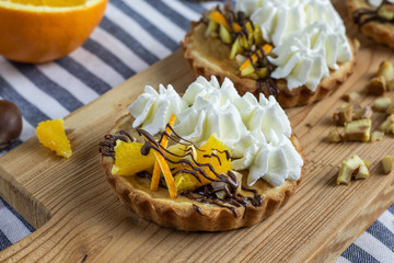detail of Tartlets with chestnut filling with orange and whipped cream