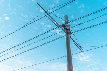 electric pole and wires under the blue sky 