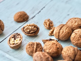 walnuts in basket on wooden background