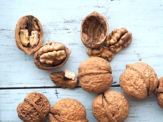 walnuts and nutcracker on wooden background