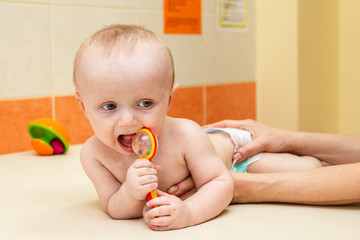 Pediatric Physical Therapy - an infant exercising on a table