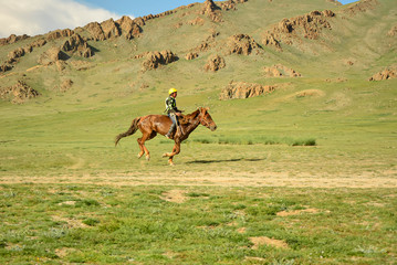Naklejka na ściany i meble Mongolian horse race during Naadam festival in western Mongolia. Naadam is inscribed on the List of the Intangible Cultural Heritage of Humanity.