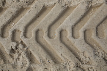 tire tracks in the sand. Texture, background, pattern