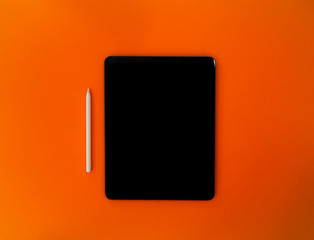 Tablet for creatives with orange background