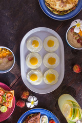 Authentic wooden table with healthy Breakfast on top.
