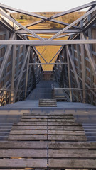 Urban architecture with steel stairs and wooden elements. Route up the observation tower with metal framework. 
