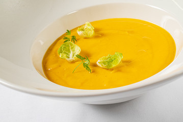 pumpkin cream soup in the white plate