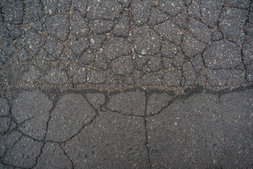 Obraz premium The surface of the bad asphalt