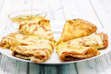 delicious pancakes on wooden table on the plate