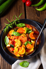 zucchini vegetarian ratatouille with tomato sauce and herbs