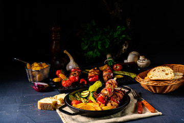 Naklejka na ściany i meble Shish kebab with various vegetables and spice country potatoes