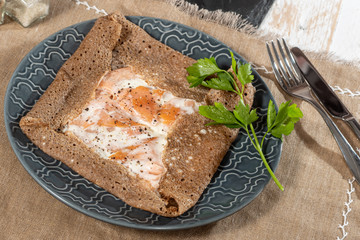 Breton crepe with egg in blue plate