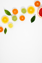 Citrus fruits pattern. Exotic fruits on white background. lemon, grapefruit, orange, lime, tangerine, fruit slices. Flat lay, top view, copy space