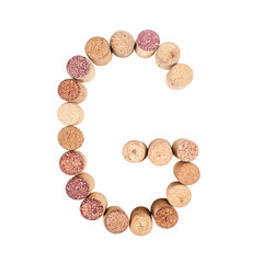 The letter "G" is made of wine corks. Isolated on white background