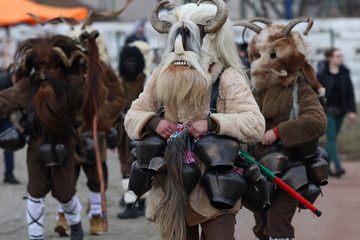 Elin Pelin, Bulgaria - February 15, 2020: Masquerade festival in Elin Pelin, Bulgaria. People with mask called Kukeri dance and perform to scare the evil spirits.