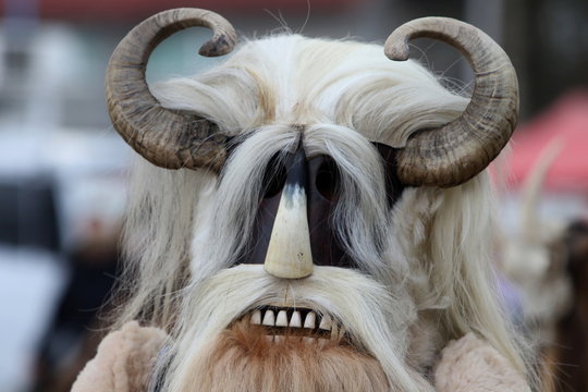 Elin Pelin, Bulgaria - February 15, 2020: Masquerade festival in Elin Pelin, Bulgaria. People with mask called Kukeri dance and perform to scare the evil spirits.