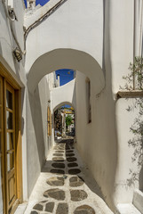Cobblestone street in Mykonos Island, Greece.