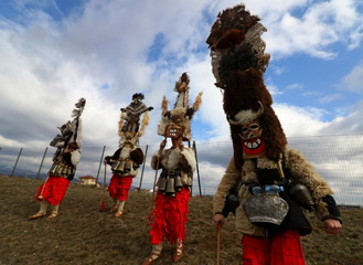 Obraz premium Elin Pelin, Bulgaria - February 15, 2020: Masquerade festival in Elin Pelin, Bulgaria. People with mask called Kukeri dance and perform to scare the evil spirits.